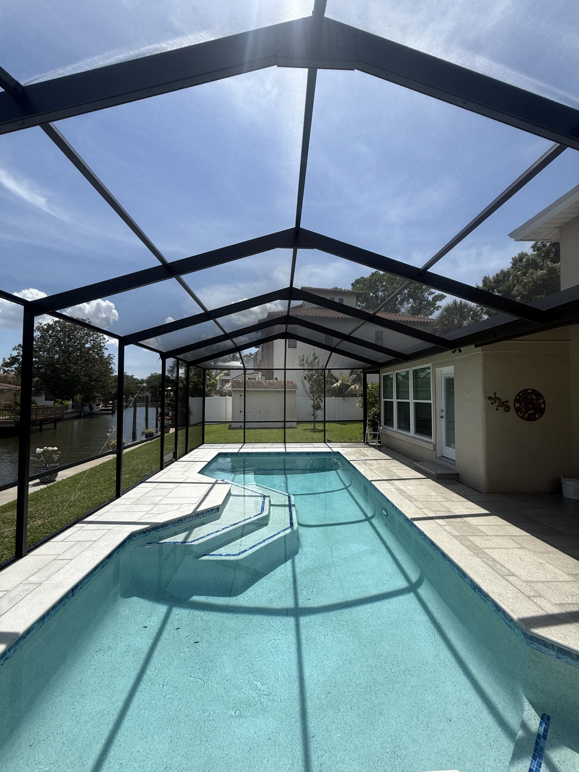Bronze pool cage after painting and restoration in Tampa Florida