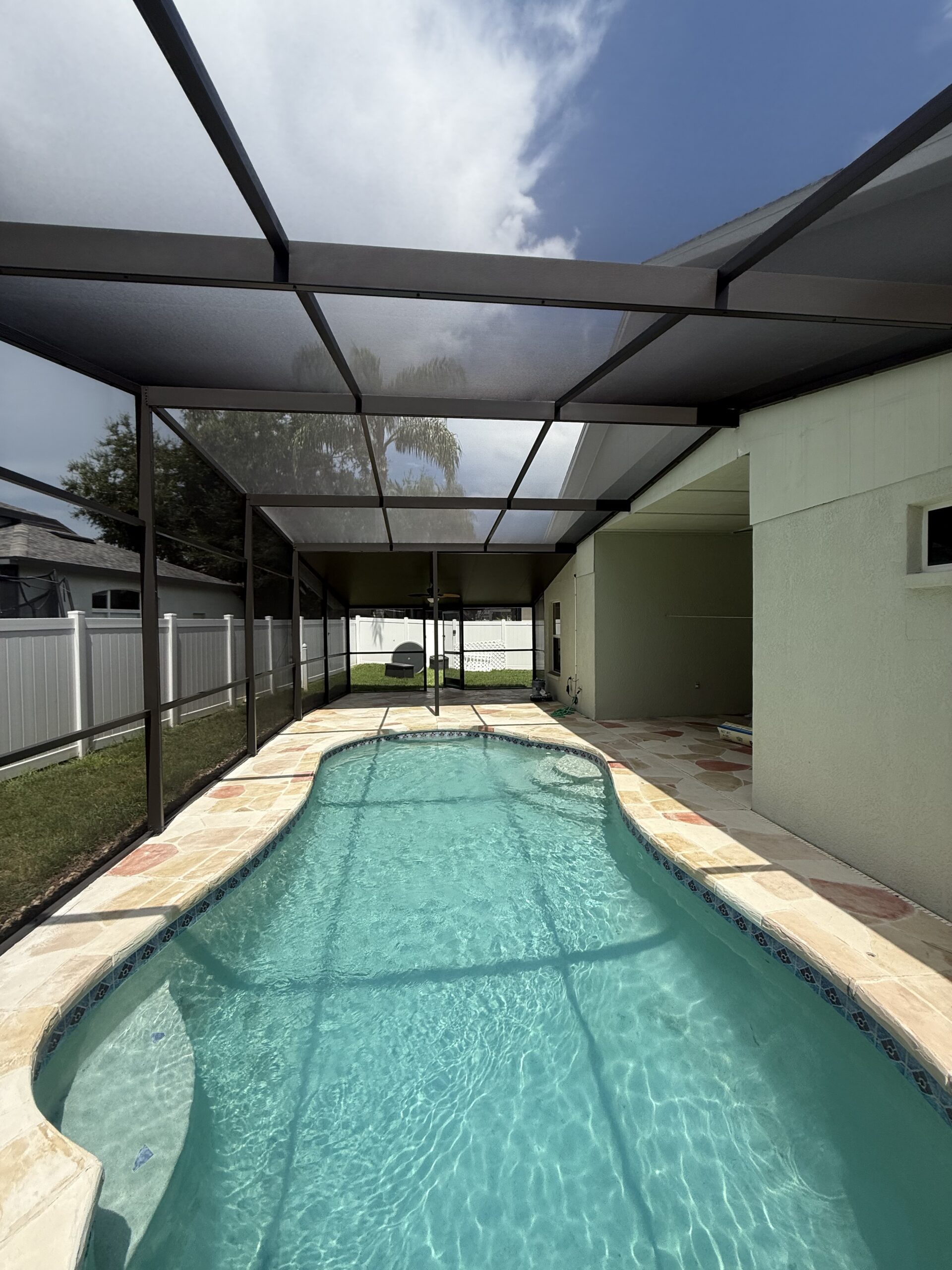 Bronze pool cage after painting and 20x20 No-See-Um Super Screen installation in Tampa Bay